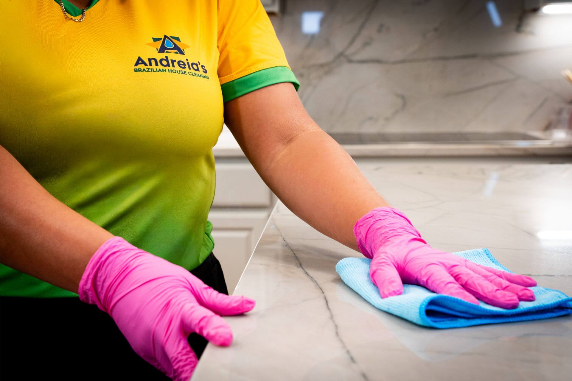A cleaner from Andreia's Brazilian House Cleaning refreshing a Triangle Area home